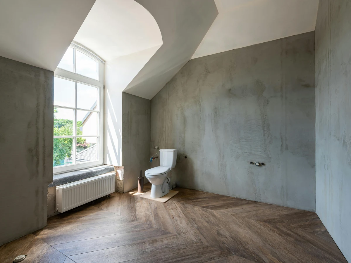 Bathroom painting preparation in Sheffield, bare concrete bathroom ready for moisture-resistant coating