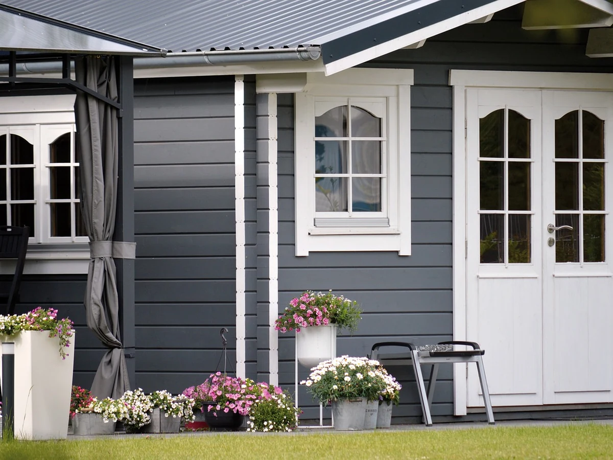 Timber exterior painting on grey and white house by Sheffield Decorators