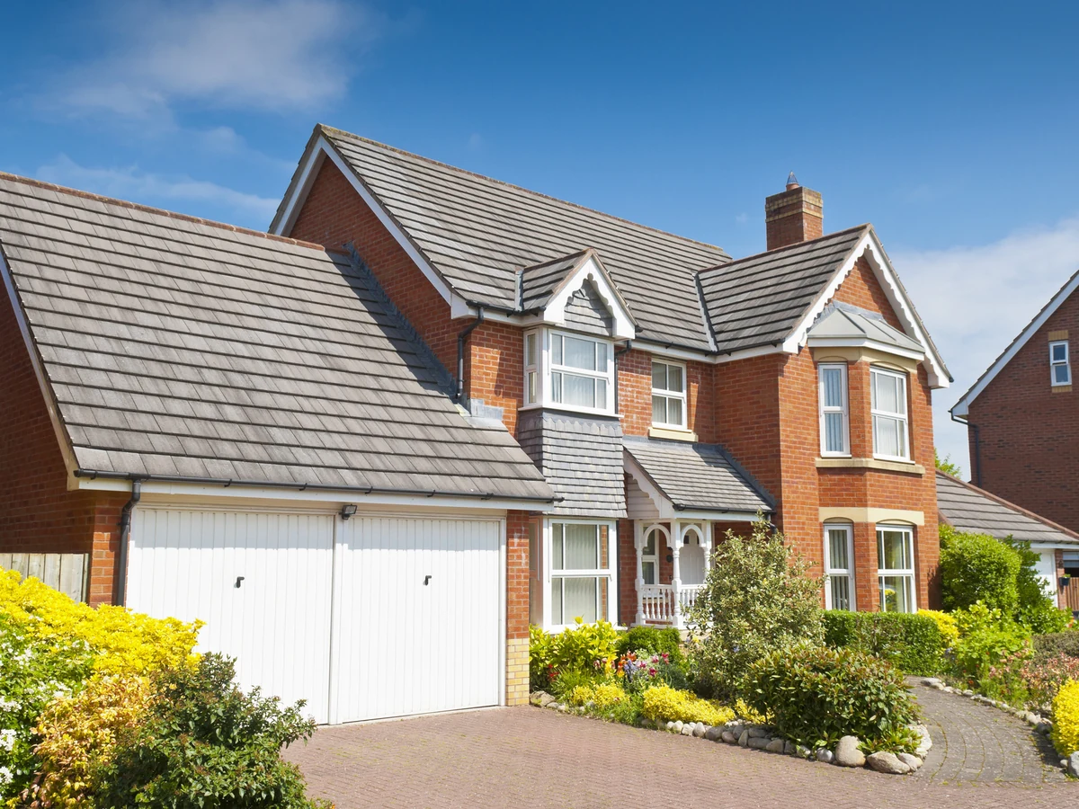 Red brick detached house exterior painting in Sheffield
