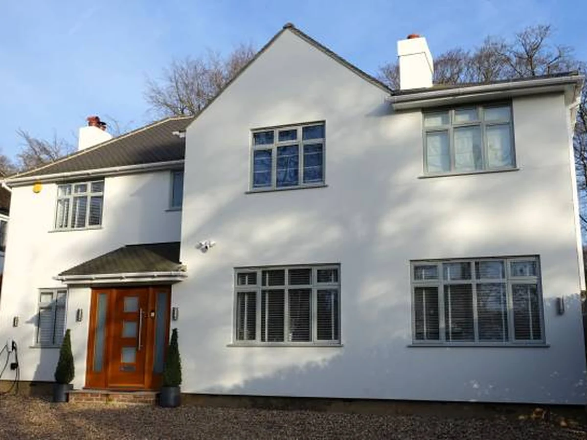 White rendered detached house exterior painted by Sheffield Decorators in Barnsley