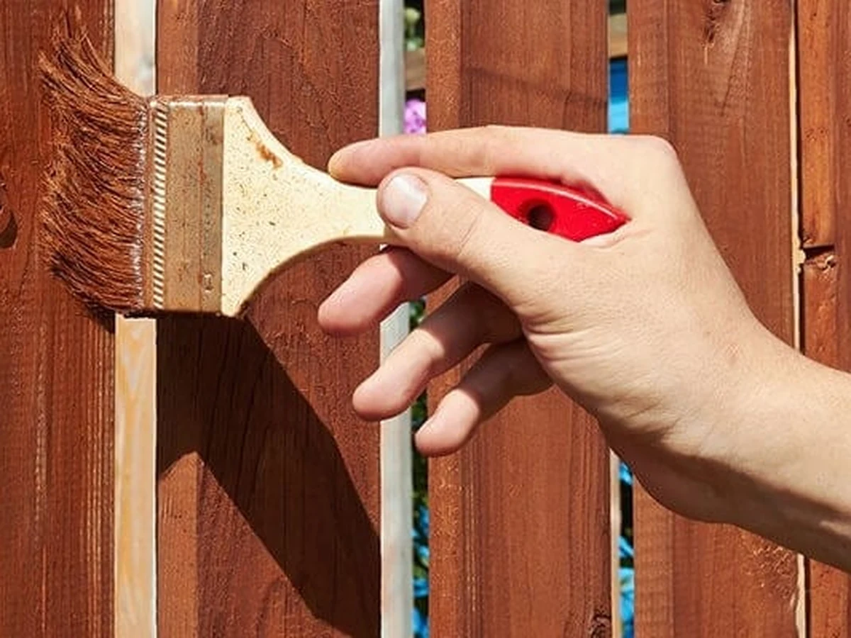 Painting a wooden picket fence in Sheffield