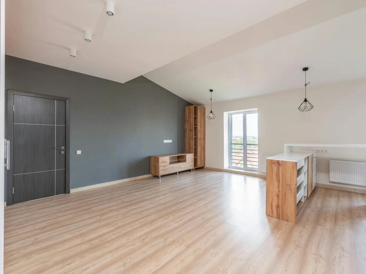 Dark painted feature wall in open room interior by Sheffield Decorators
