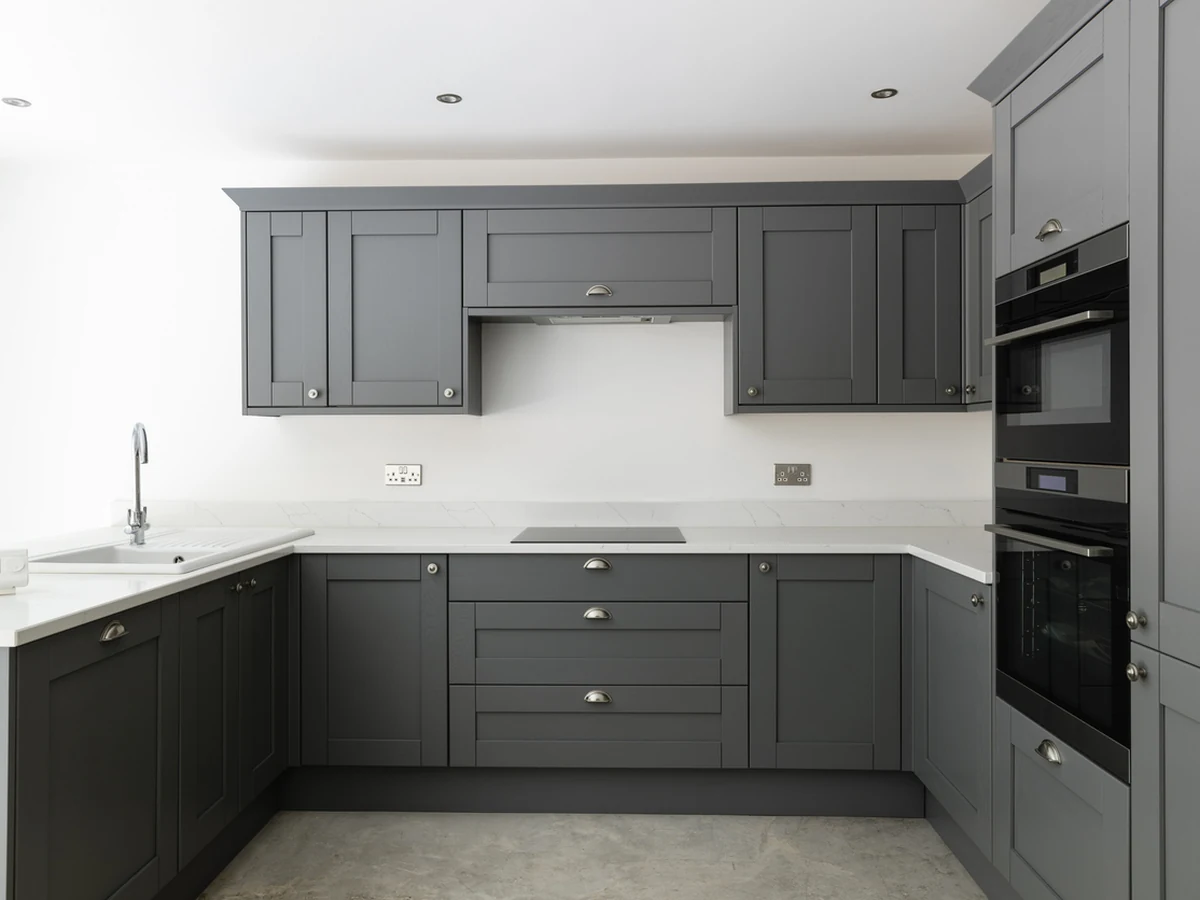 Sleek dark grey kitchen cabinets painted by Sheffield Decorators