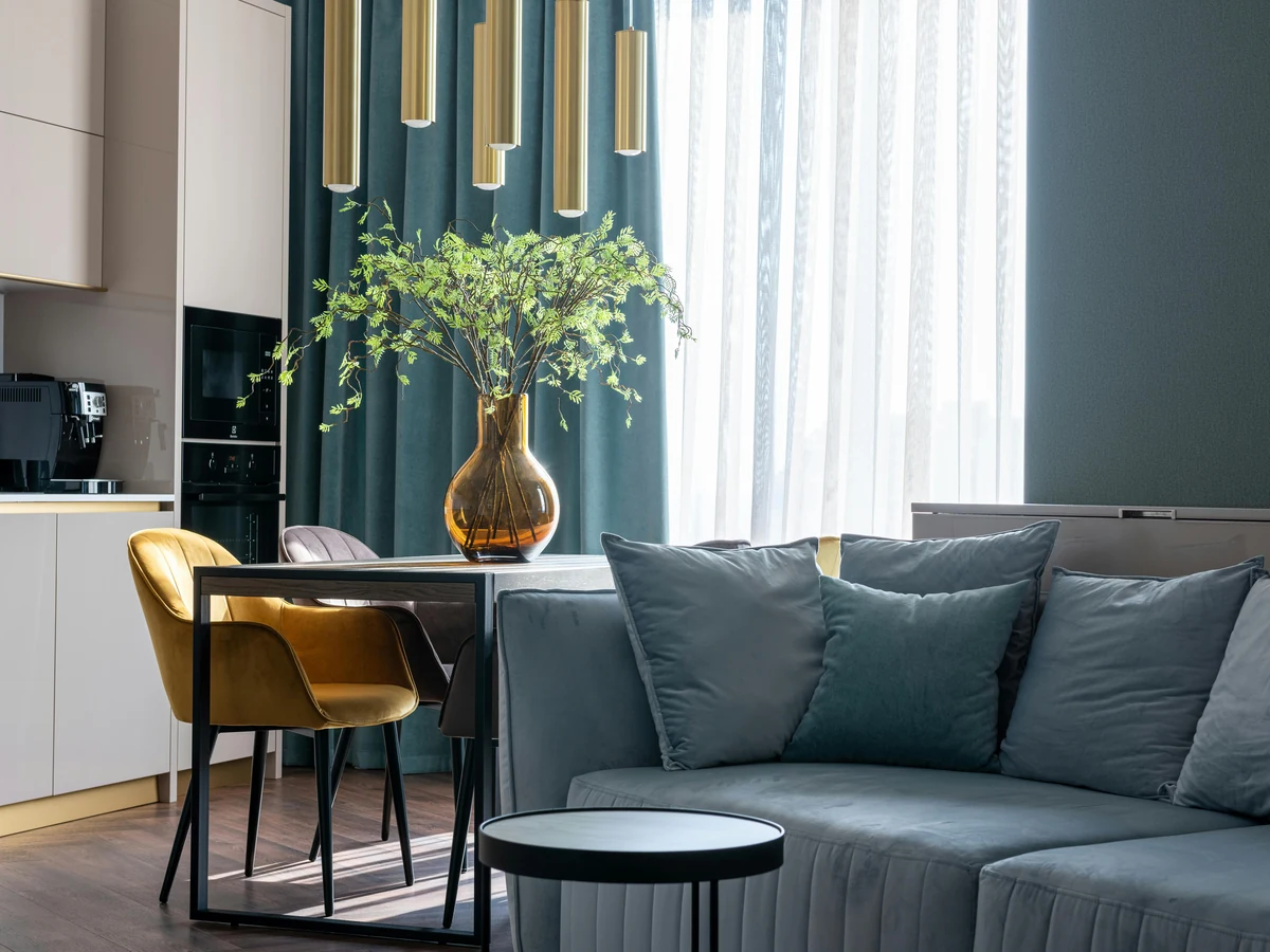 Bold teal-green feature wall in open plan living room, Sheffield Decorators interior painters