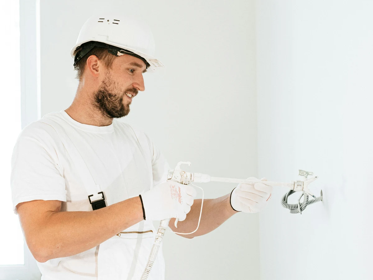 Sheffield Decorators painter examining exterior surface condition in Walkley