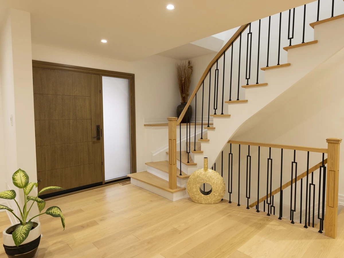 Contemporary hallway with curved staircase painted by Sheffield Decorators