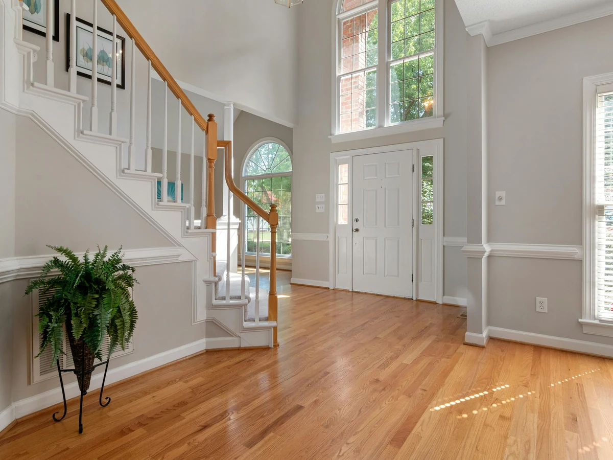 Grand hallway with white painted staircase in Sheffield period property